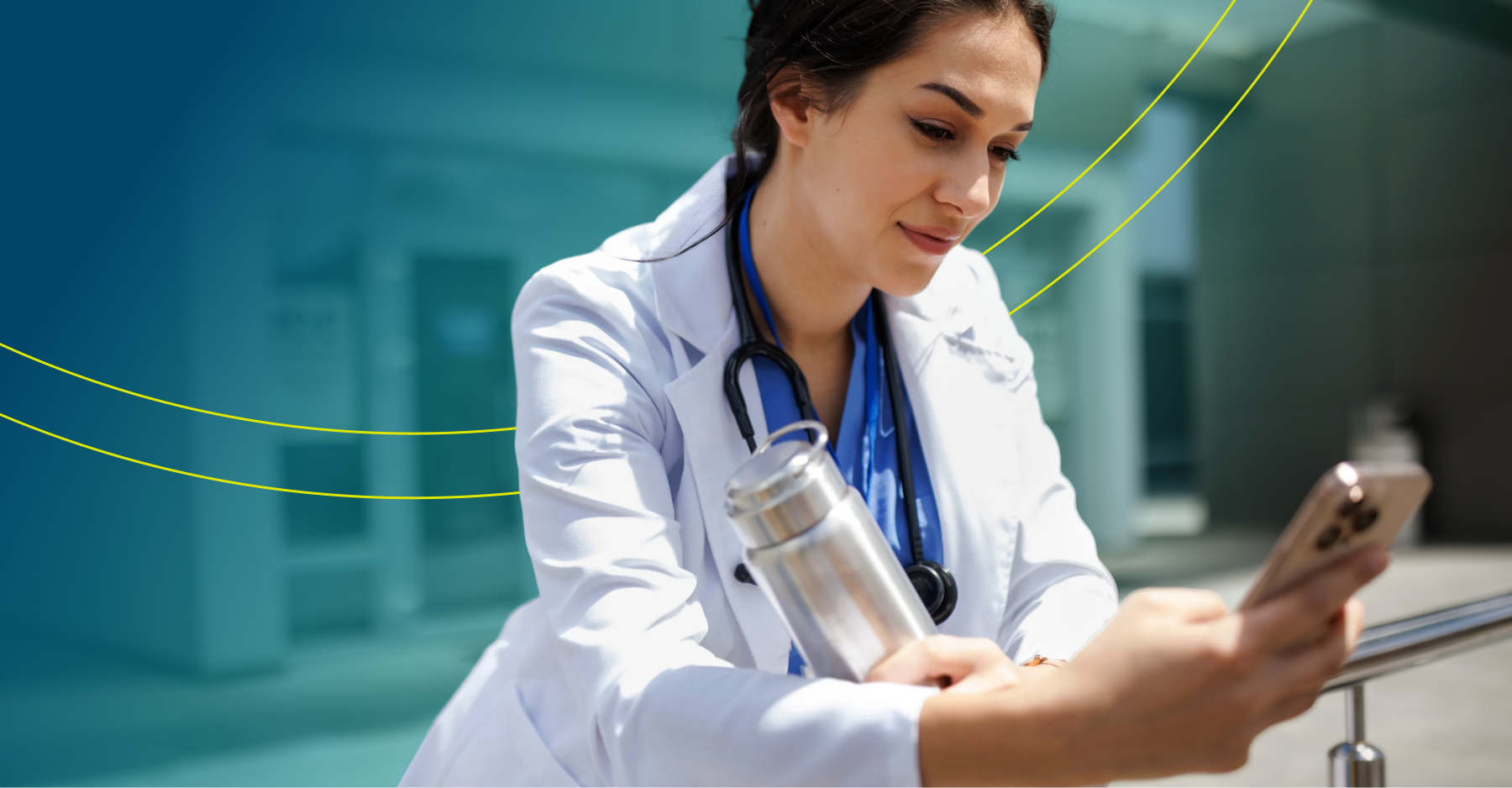 Female healthcare provider in a white coat with a stethoscope checking her phone outdoors, representing work-life flexibility in locum tenens practice